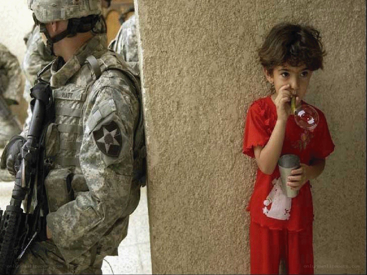 Soldier and child with bubble wand