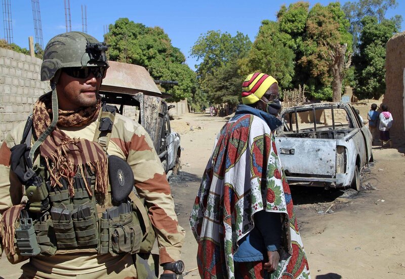 Soldier and civilian in conflict zone