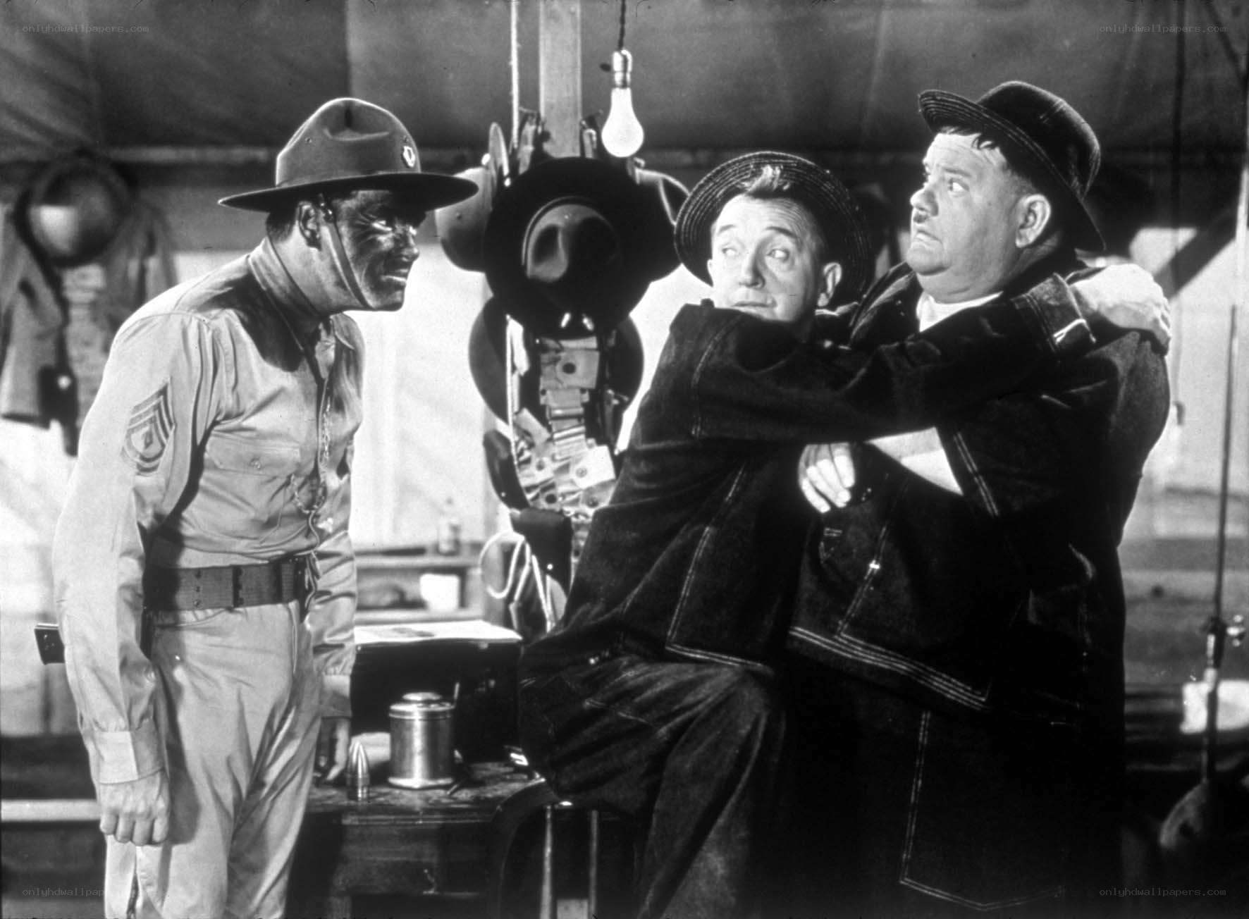 Soldier and two men in tent