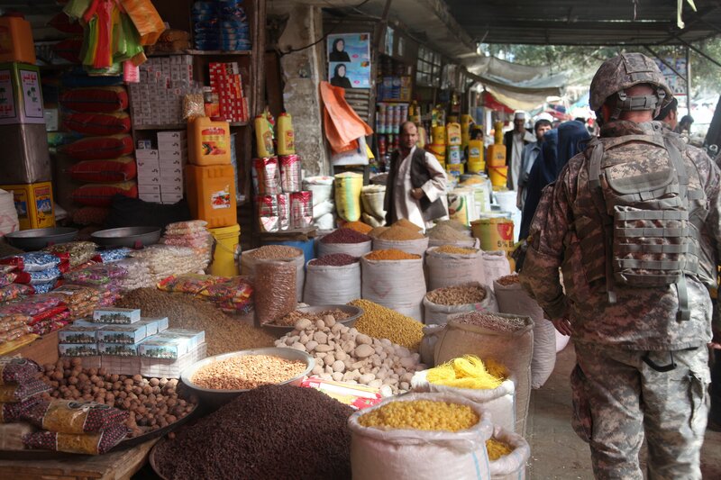 Soldier at a market in Afghanistan