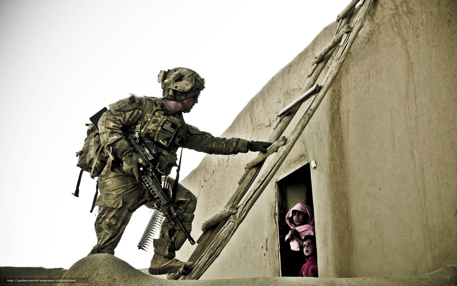 Soldier at doorway with children