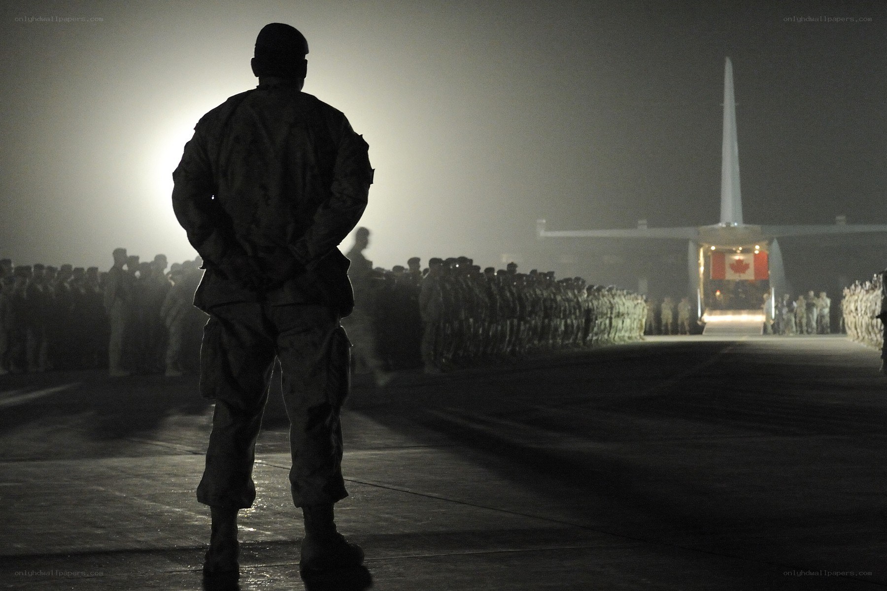 Soldier at night airfield
