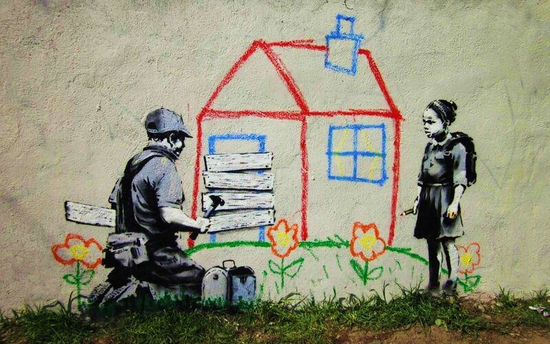 Soldier Boarding Up House