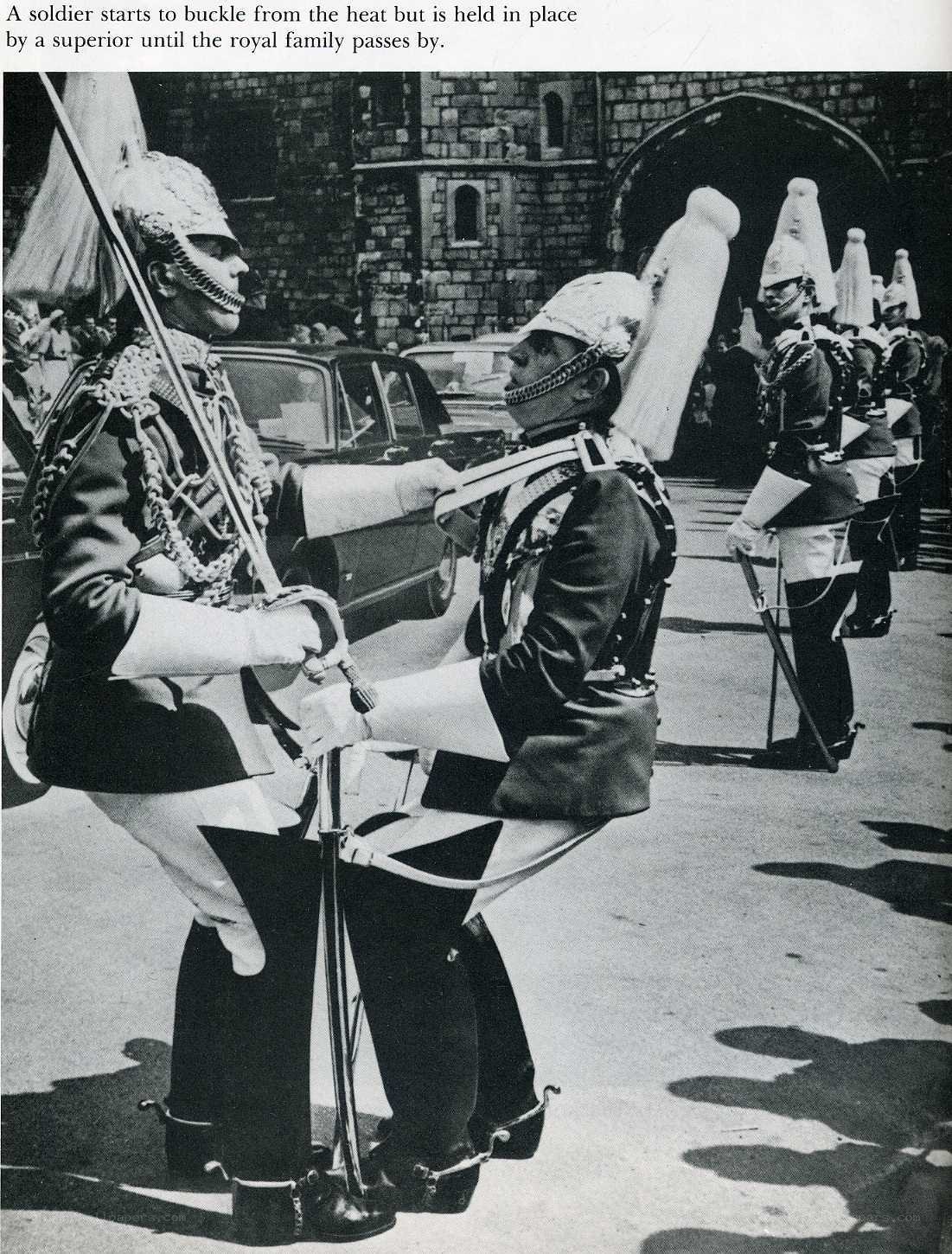 Soldier buckling during royal procession