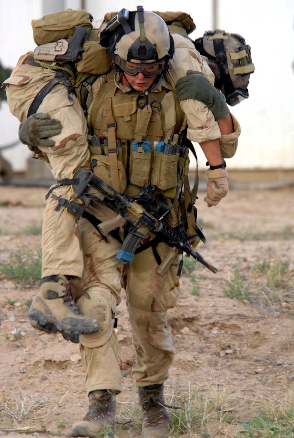 Soldier carrying wounded comrade