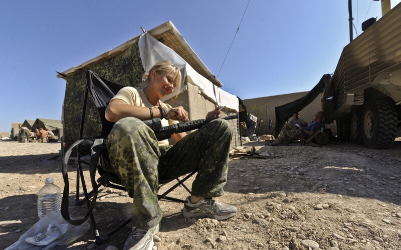 Soldier Cleaning Rifle — Green