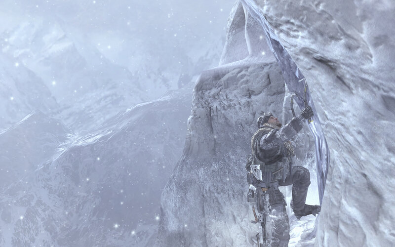 soldier climbing icy cliff