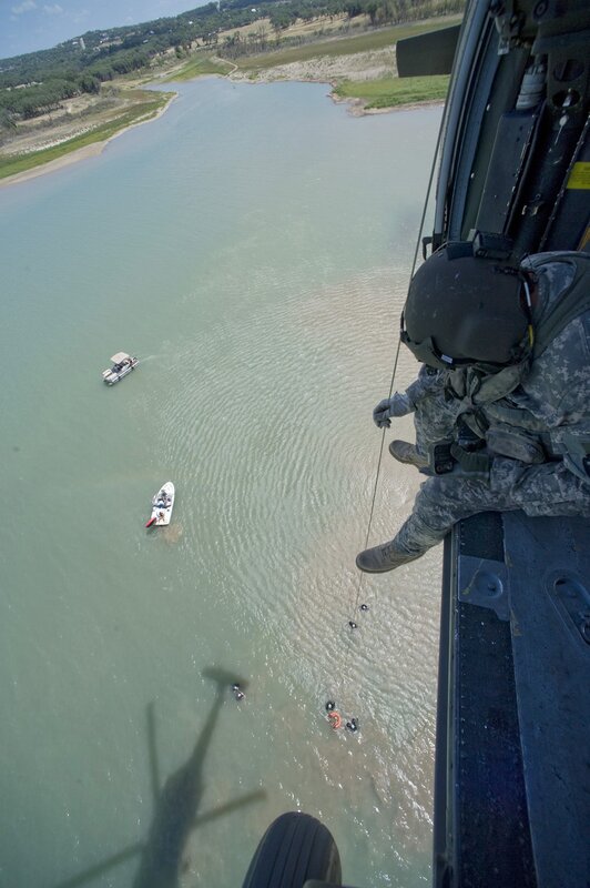 Soldier conducting water rescue from helicopter