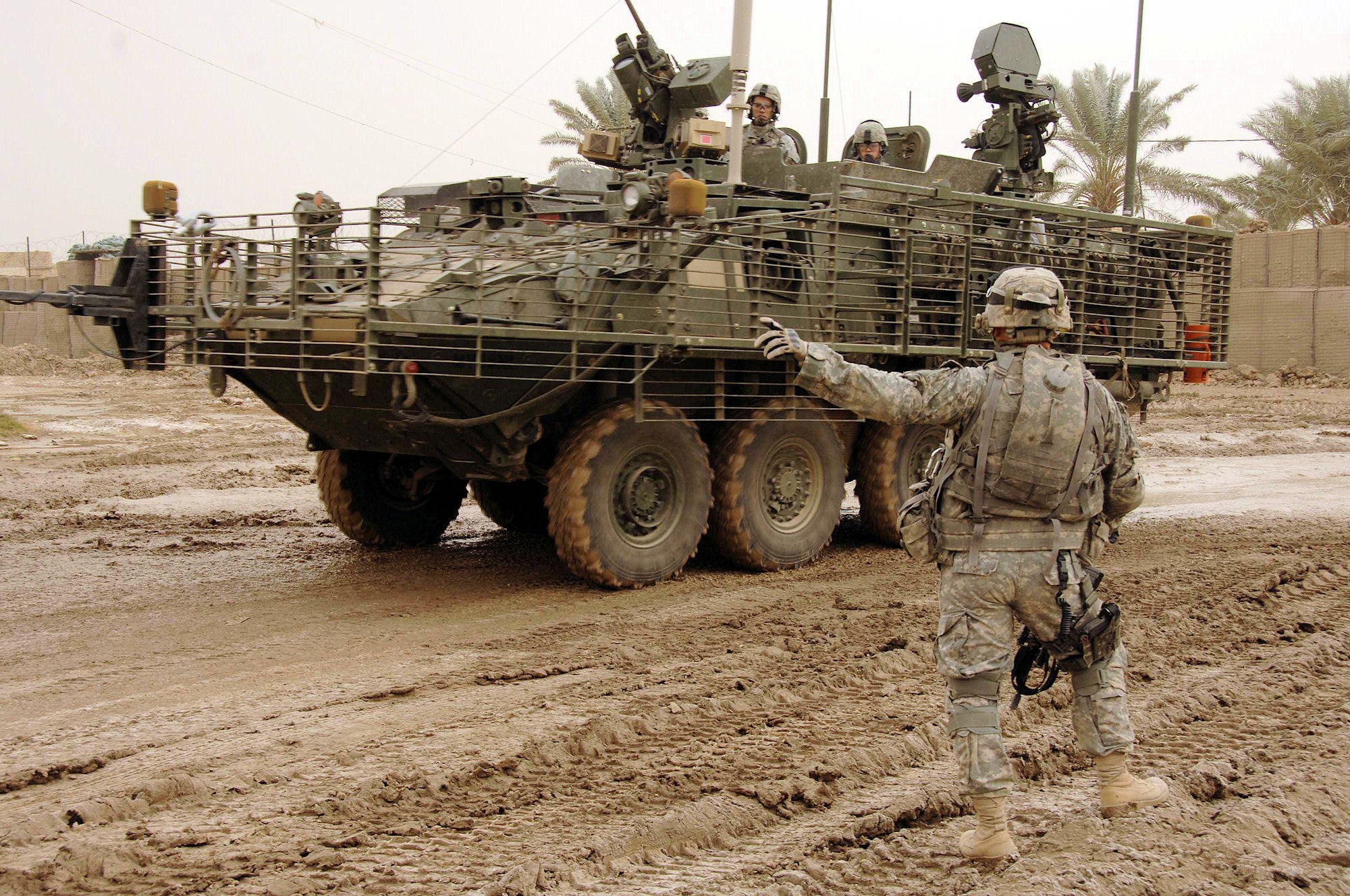 Soldier directing armored vehicle