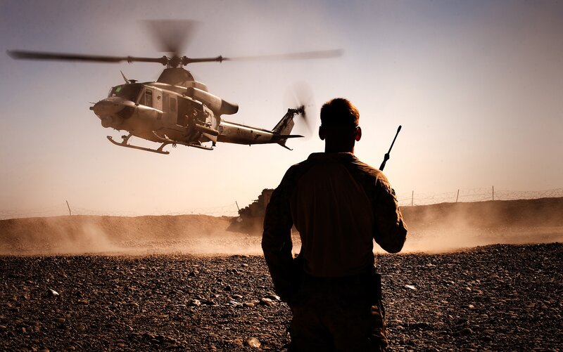 Soldier guiding helicopter landing