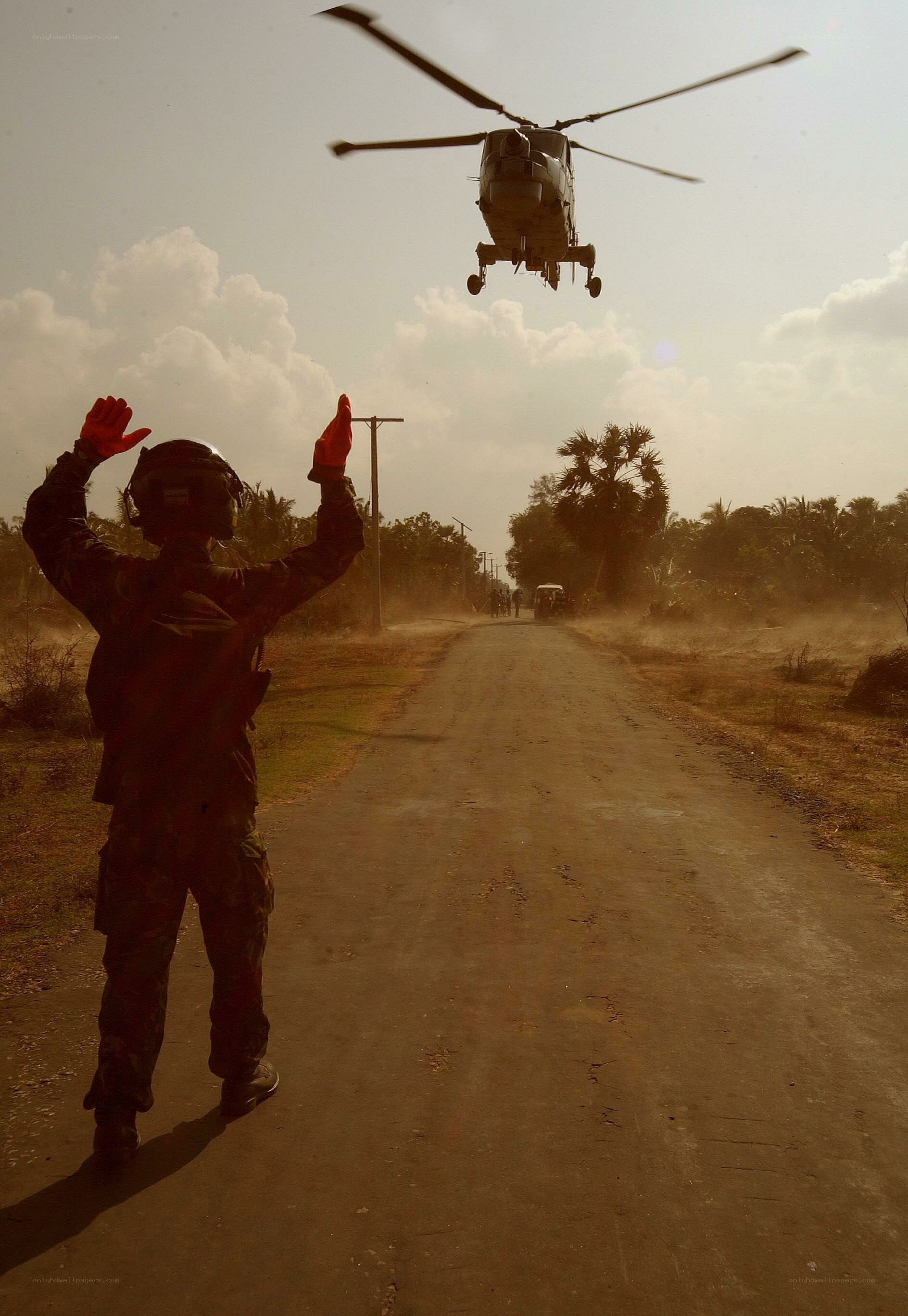 Soldier guiding helicopter landing