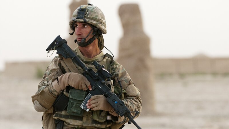 Soldier Holding Rifle — Brown, Alert