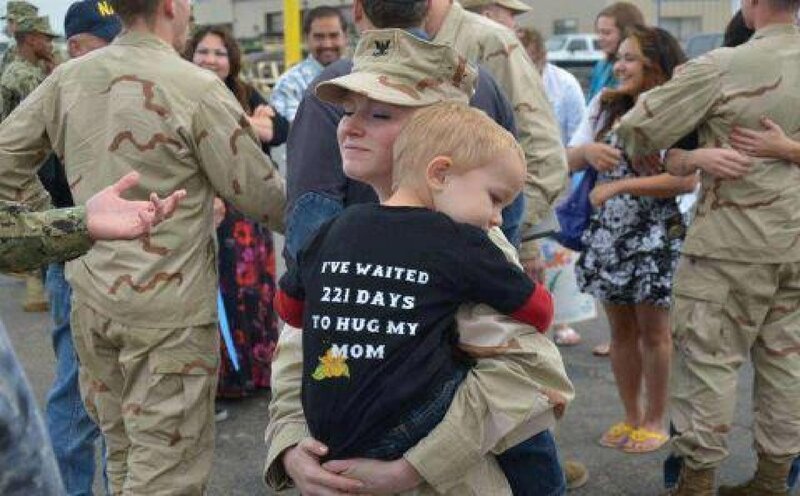 Soldier Hugging Child