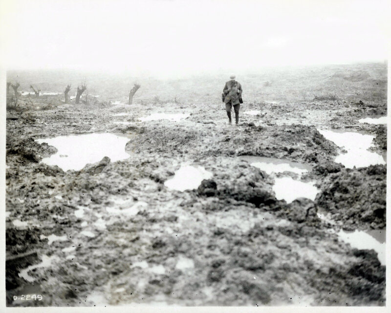 Soldier in a muddy battlefield