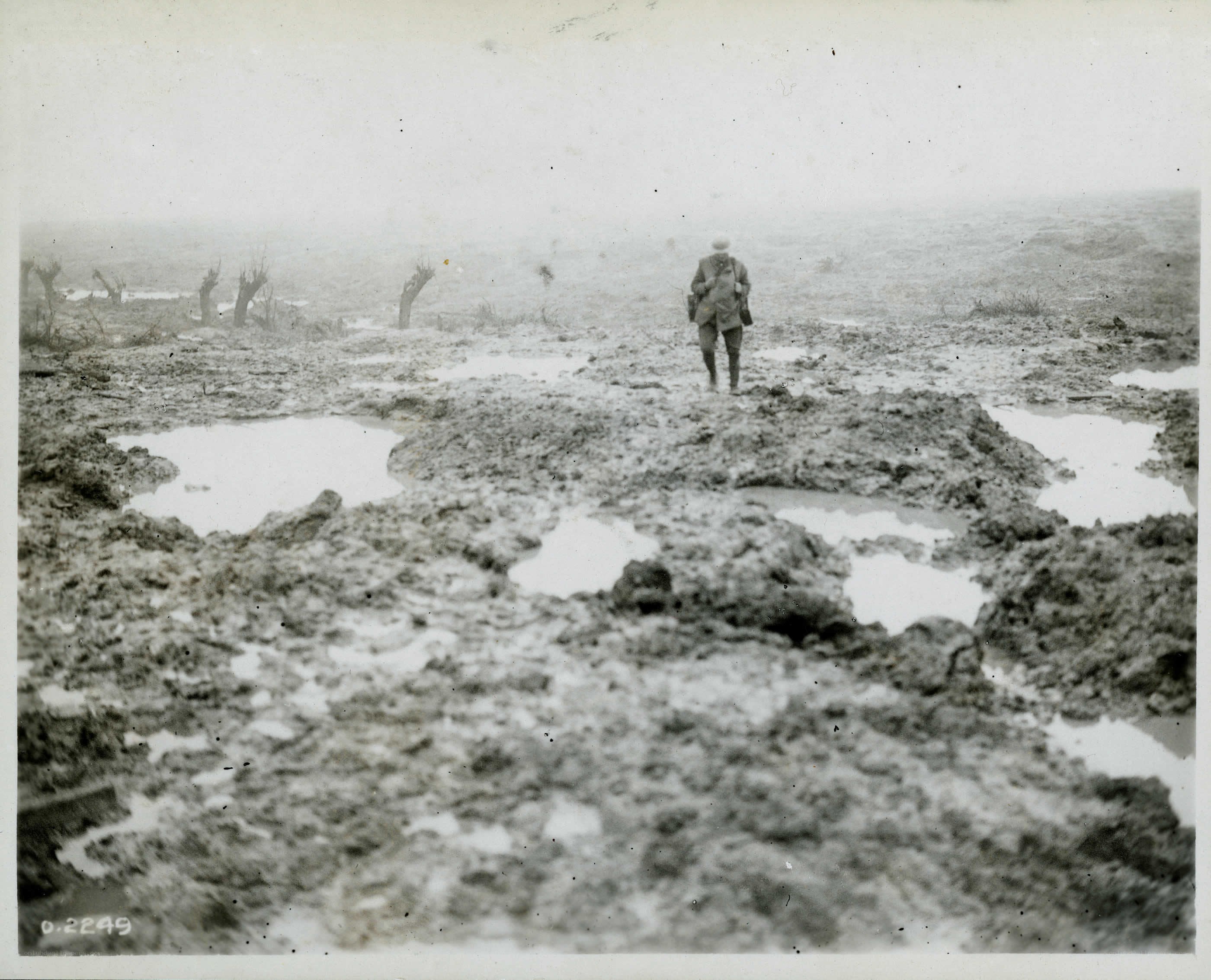 Soldier in a muddy battlefield