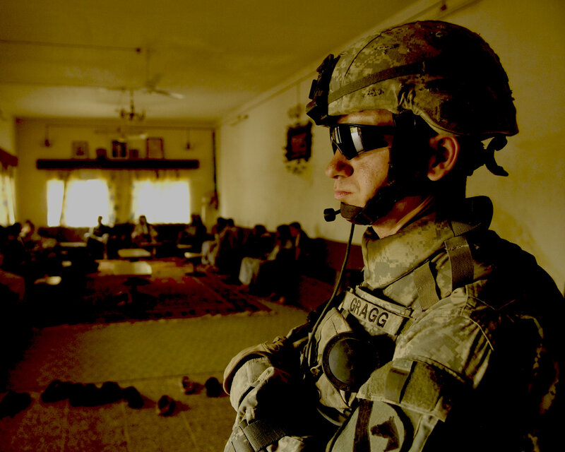 Soldier in a room with people