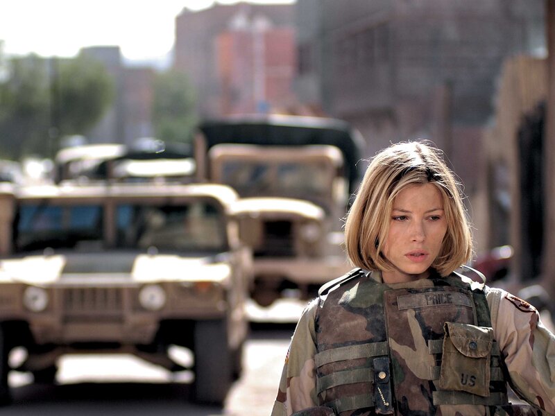 Soldier in combat gear on street