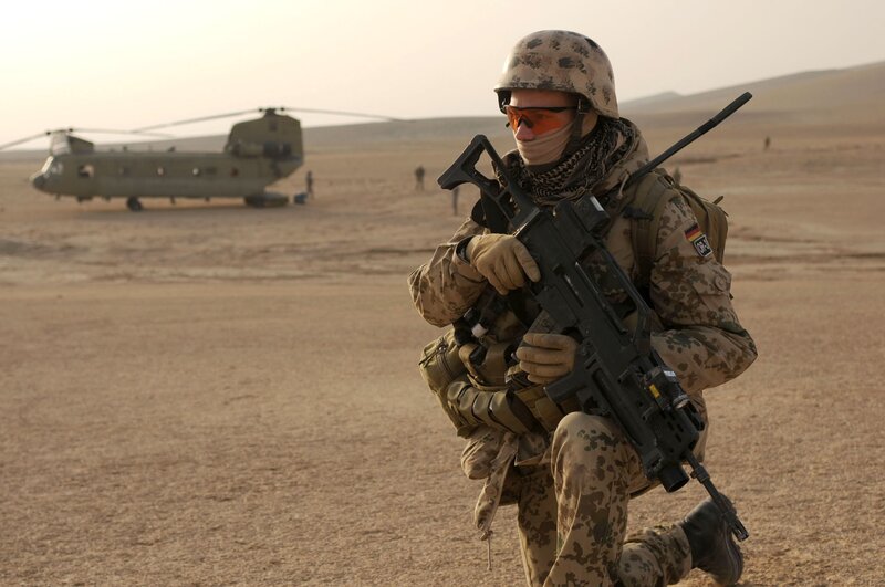 Soldier in Desert — Brown, Tense, Afternoon, Photograph, Helicopter