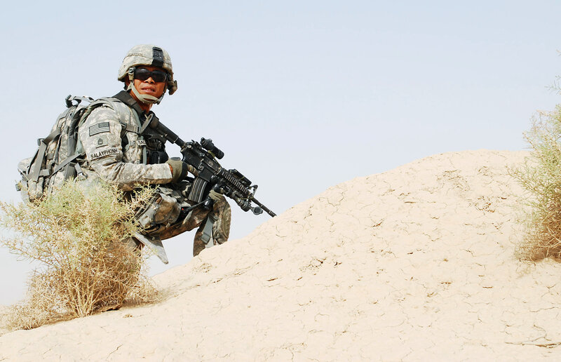 Soldier in desert terrain