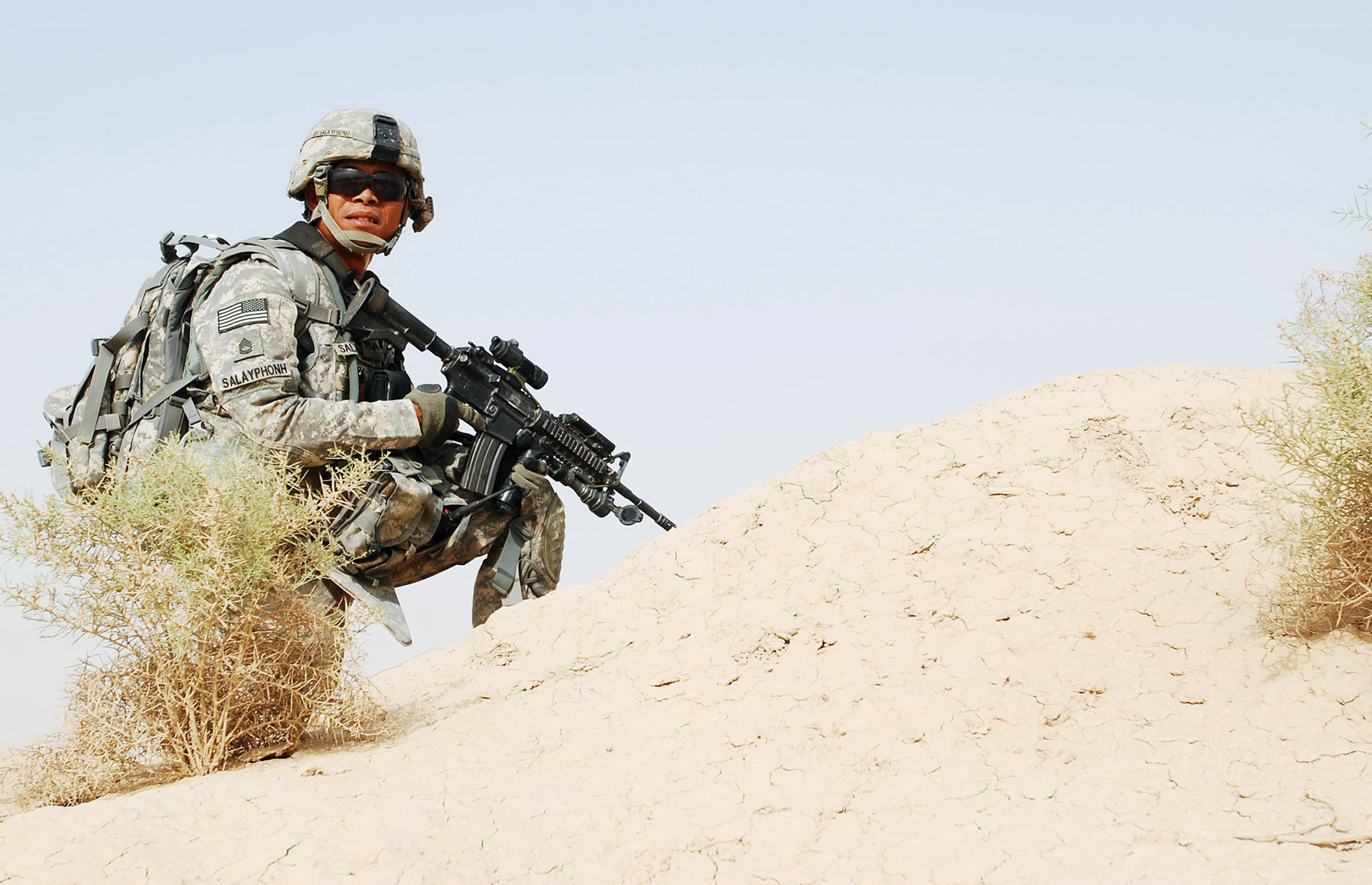 Soldier in desert terrain
