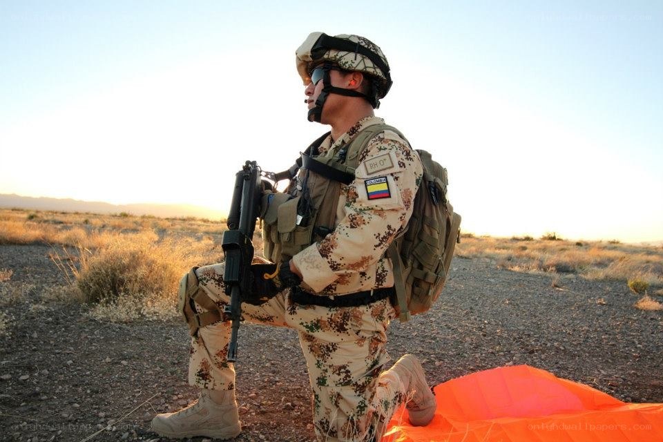 Soldier in desert terrain