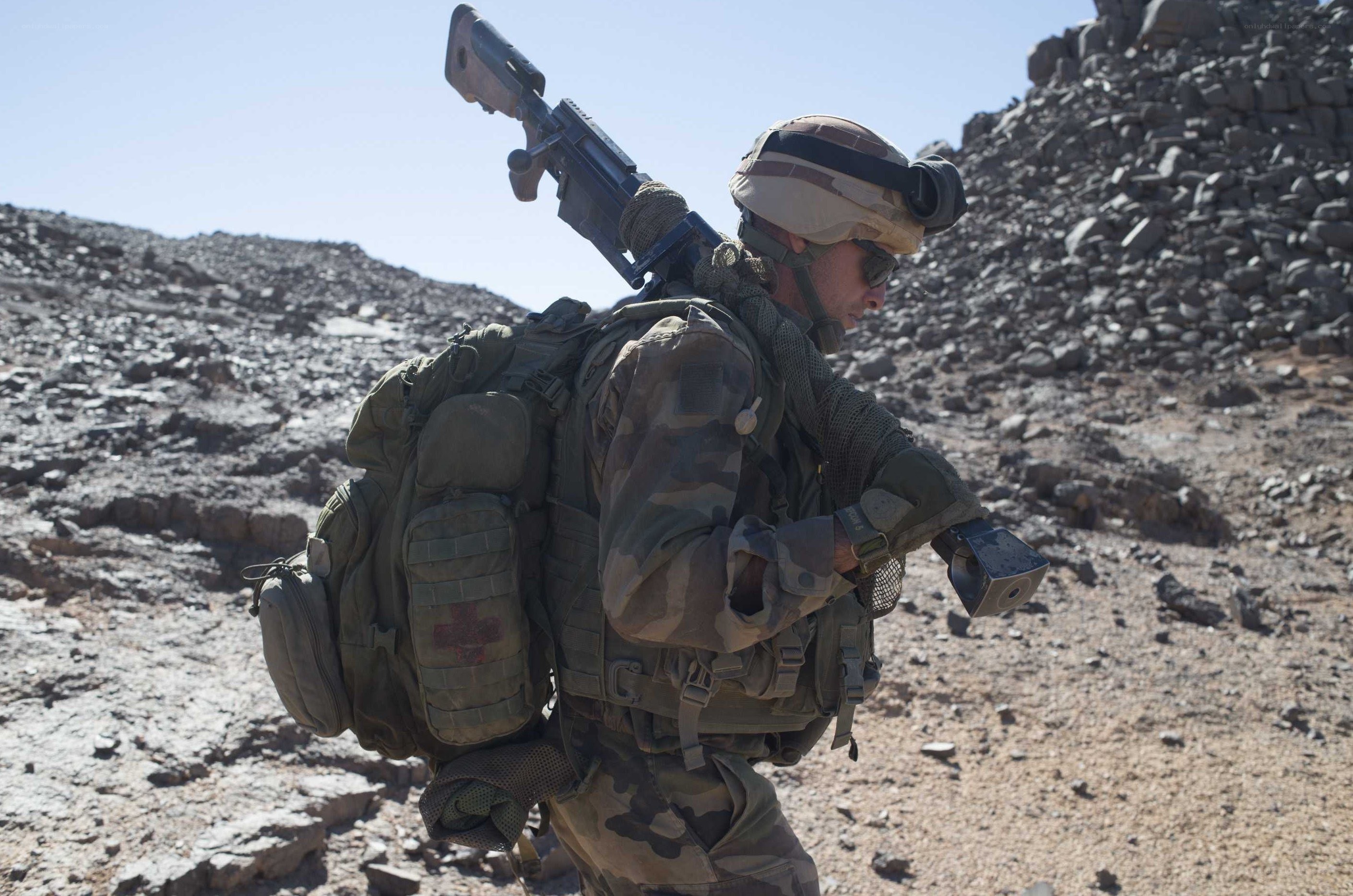 Soldier in desert terrain