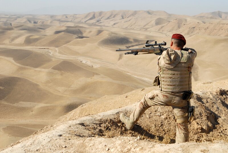 soldier in desert terrain