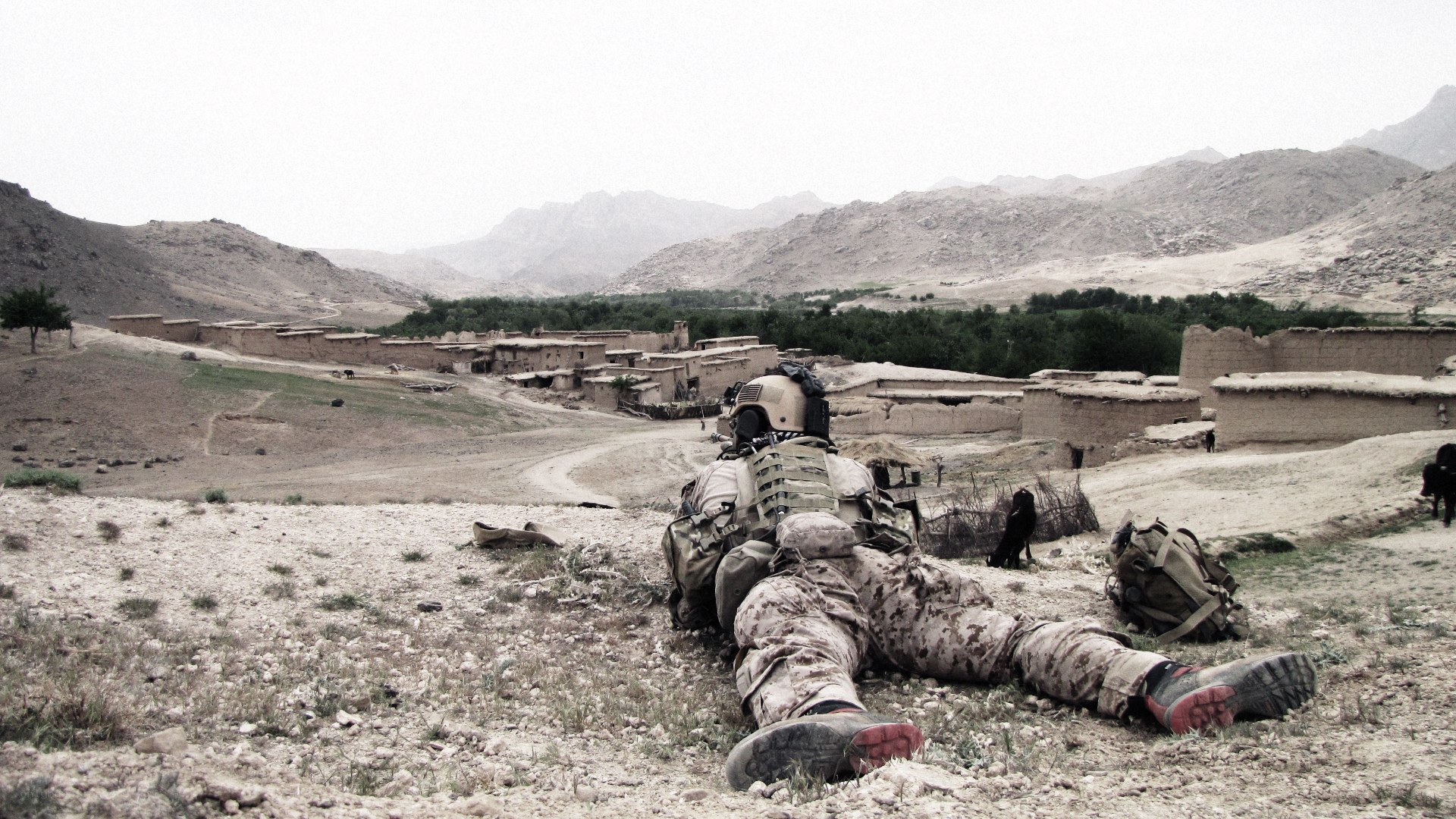 Soldier in desert village