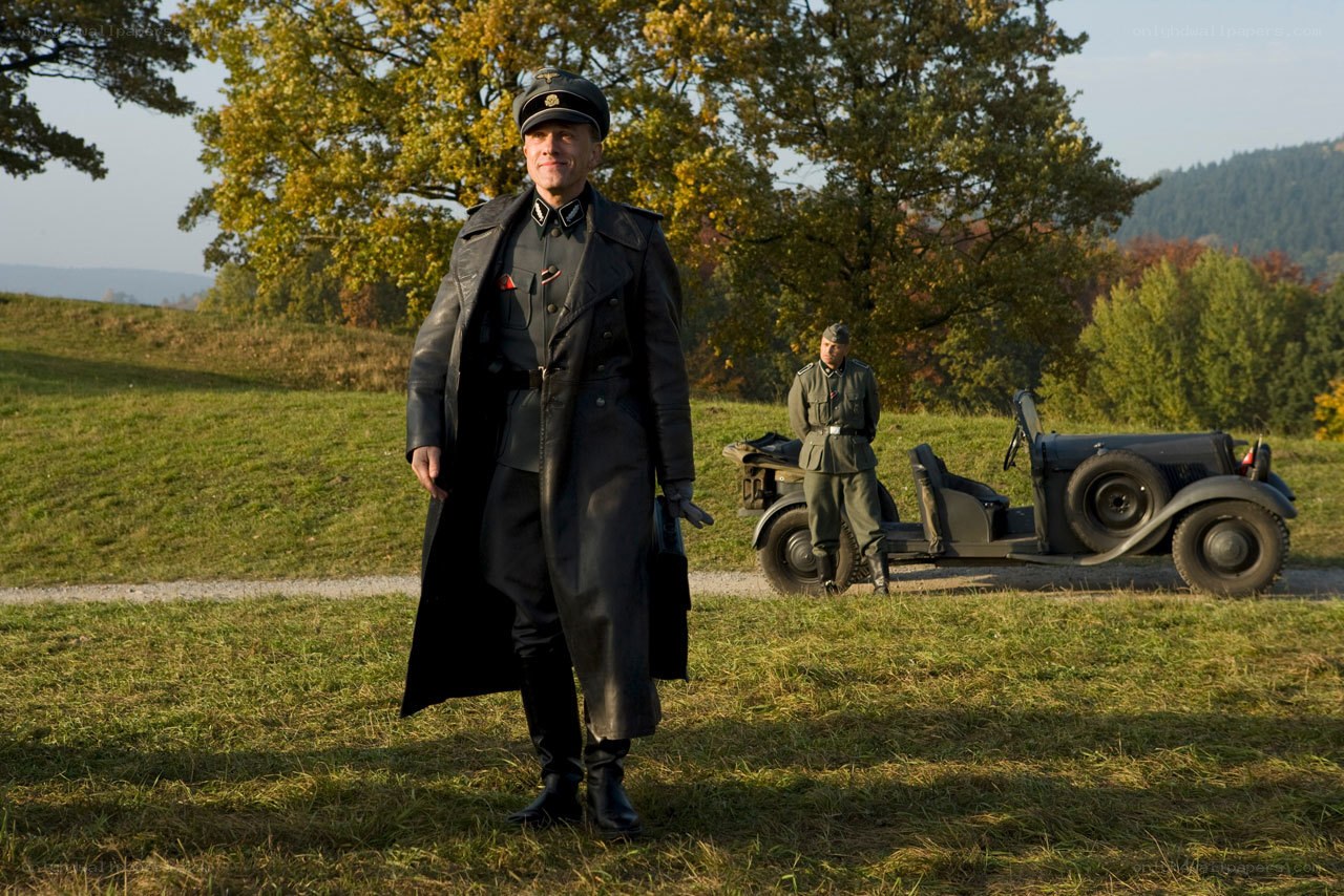 Soldier in field with car