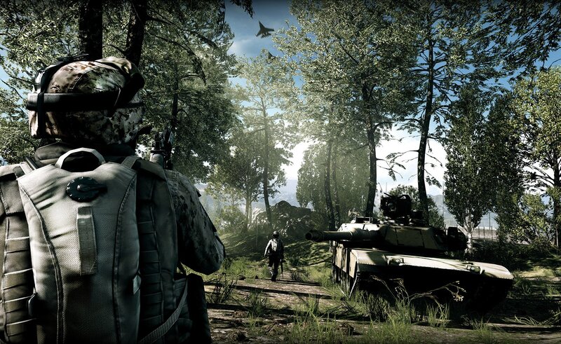 Soldier in forest with tank
