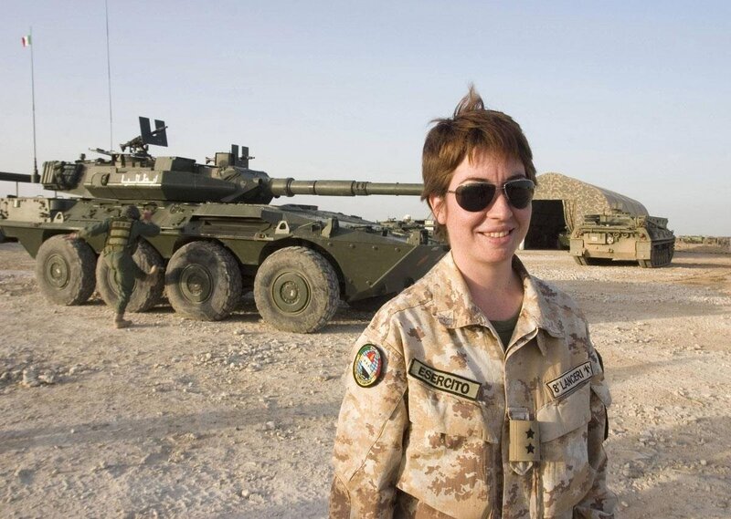 Soldier in front of tank