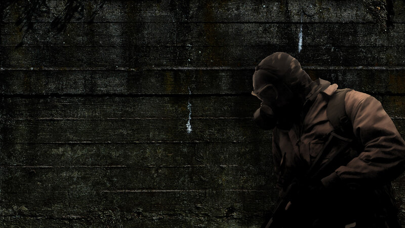 soldier in gas mask against wall