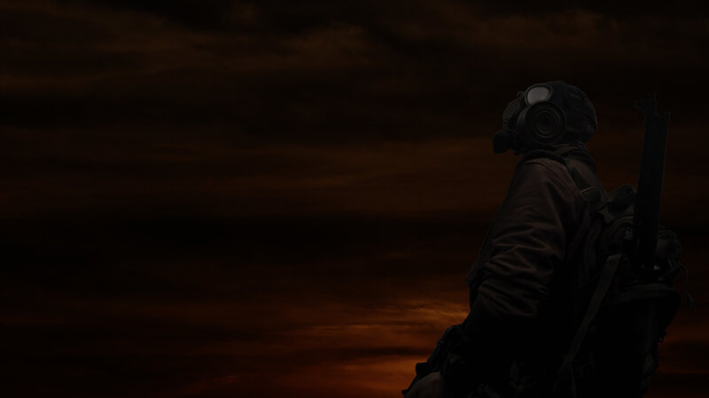 soldier in gas mask at sunset