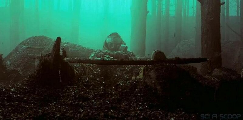 Soldier in gas mask in forest