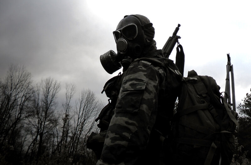soldier in gas mask with rifle