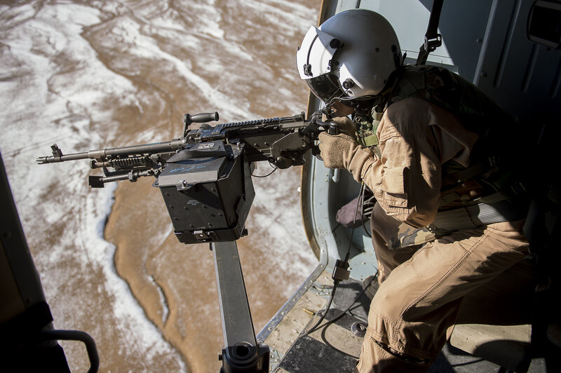 Soldier in Helicopter — Brown, Tense