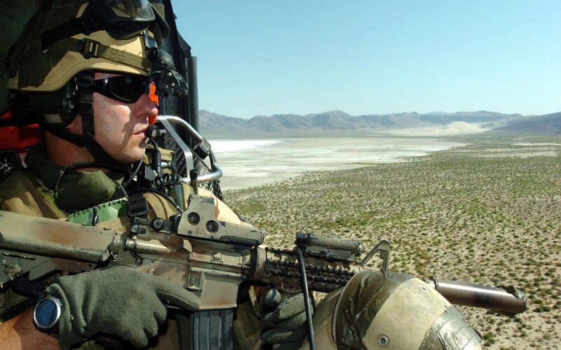 Soldier in Helicopter — Tan, Alert