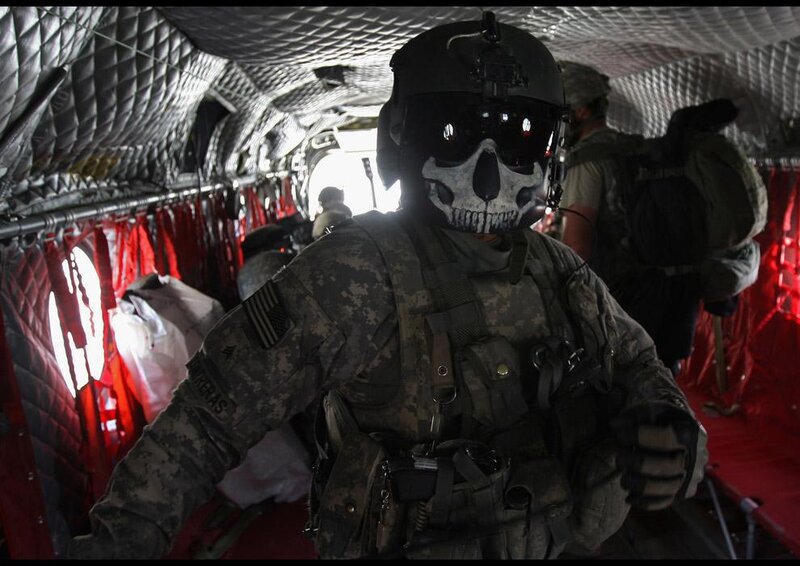 Soldier in helicopter with skull mask