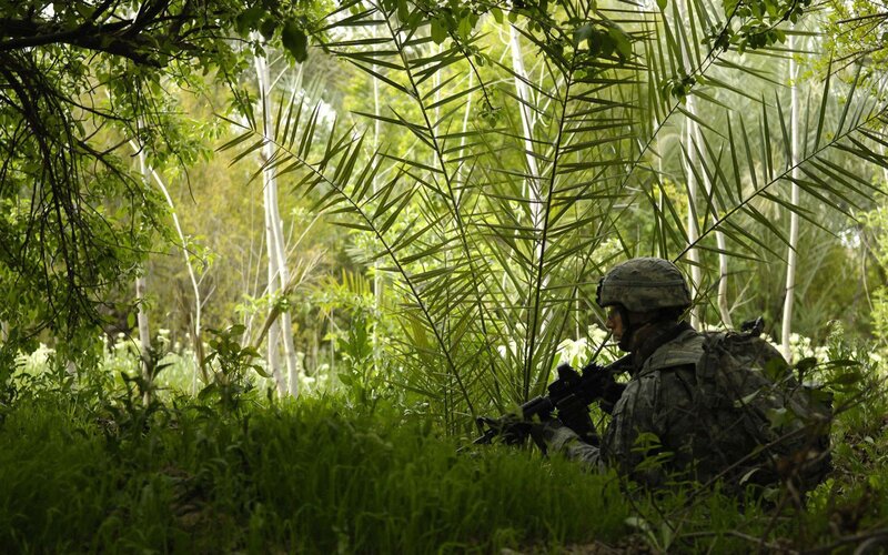 Soldier in jungle camouflage