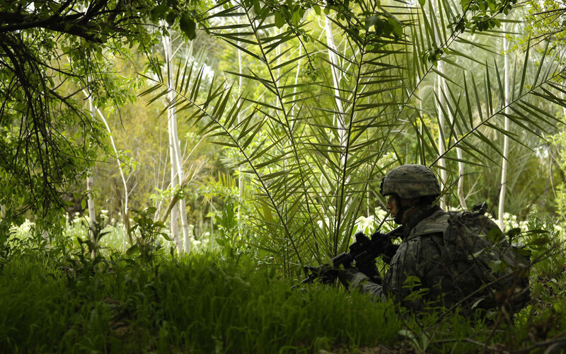 Soldier in jungle camouflage