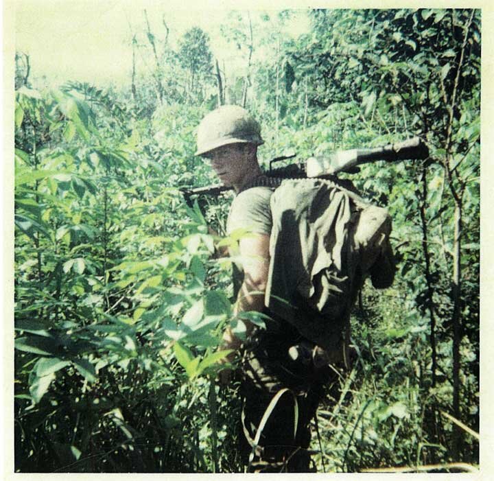 Soldier in jungle terrain