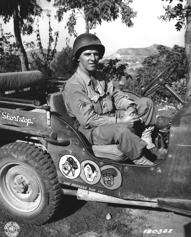Soldier in military jeep