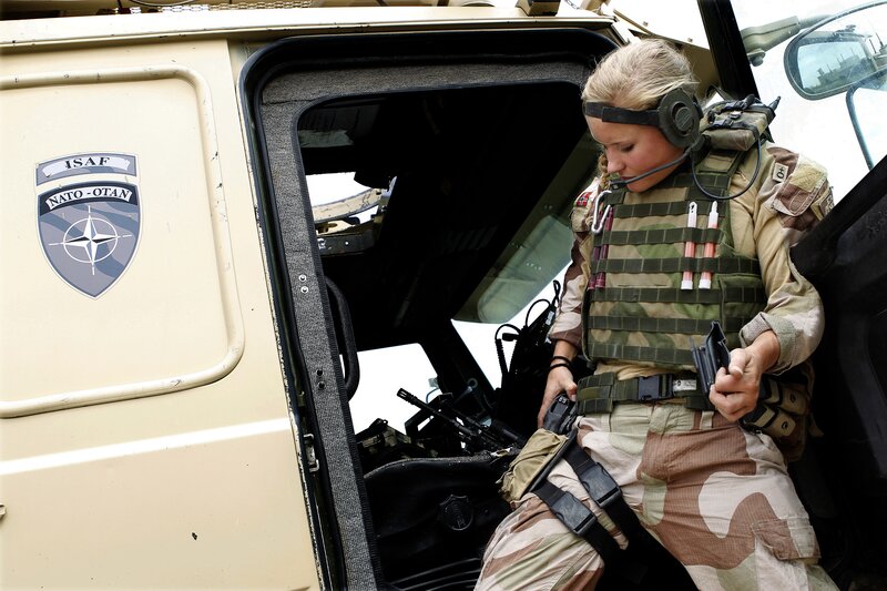 Soldier in military vehicle