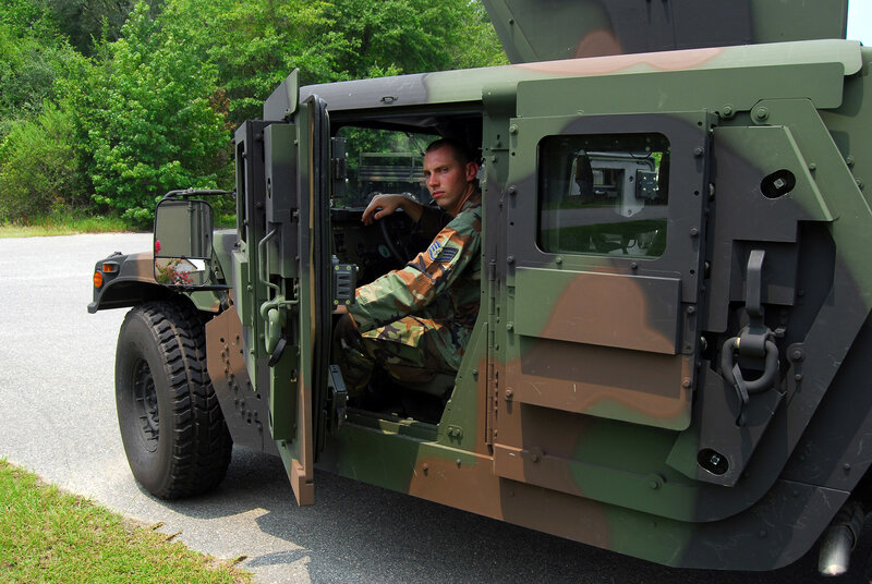 Soldier in military vehicle