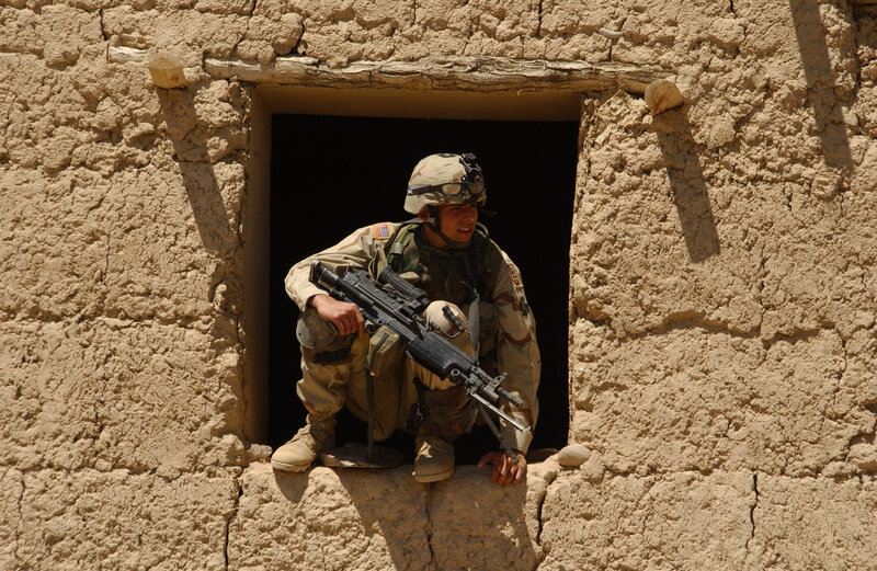 Soldier in mud-brick building