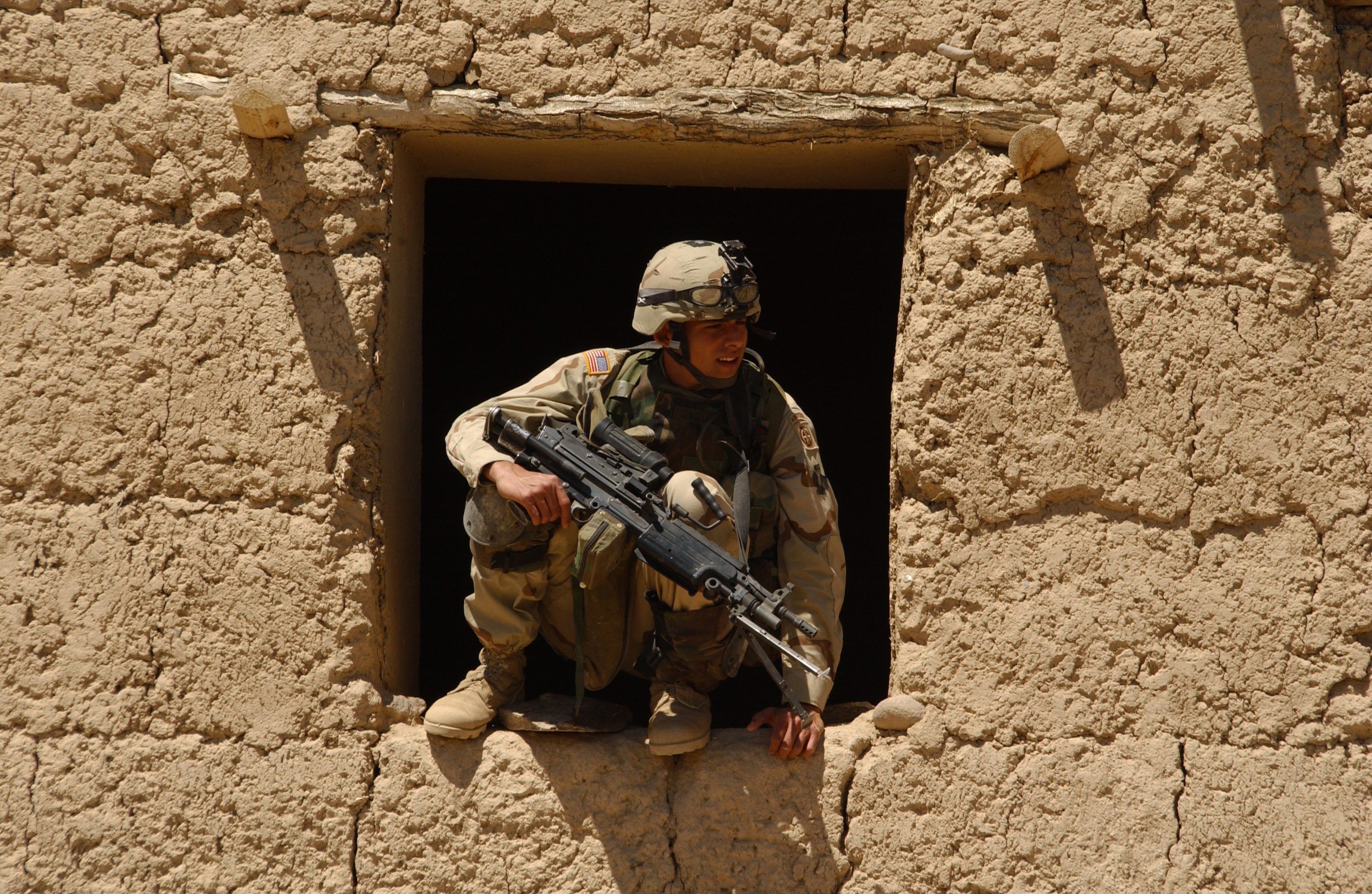 Soldier in mud-brick building