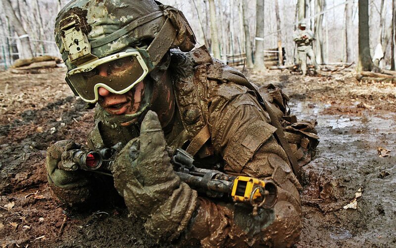 Soldier in Muddy Terrain — Brown