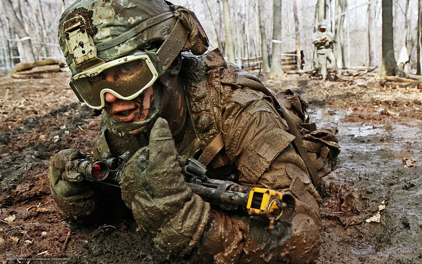 Soldier in muddy training exercise