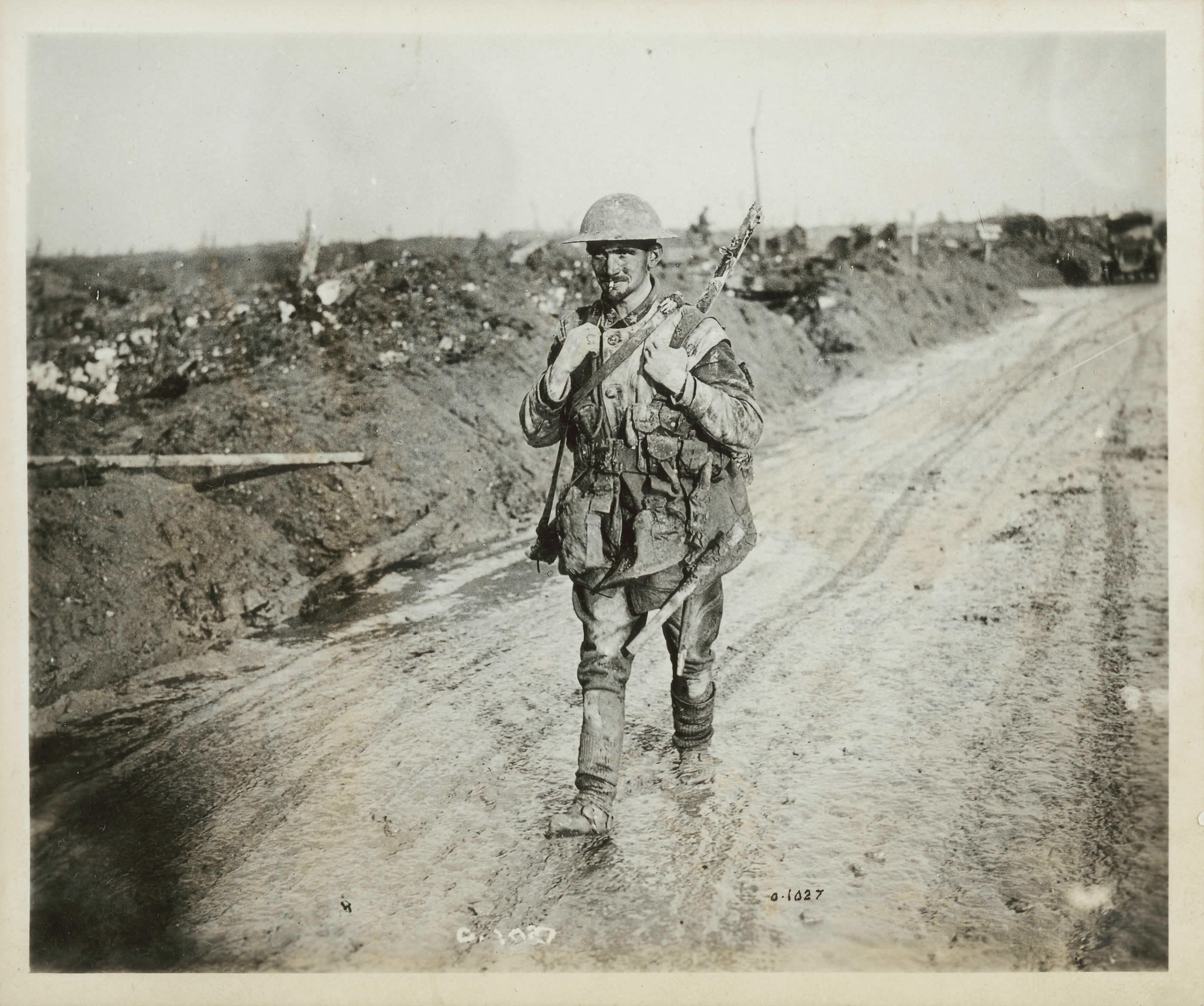 Soldier in muddy trench