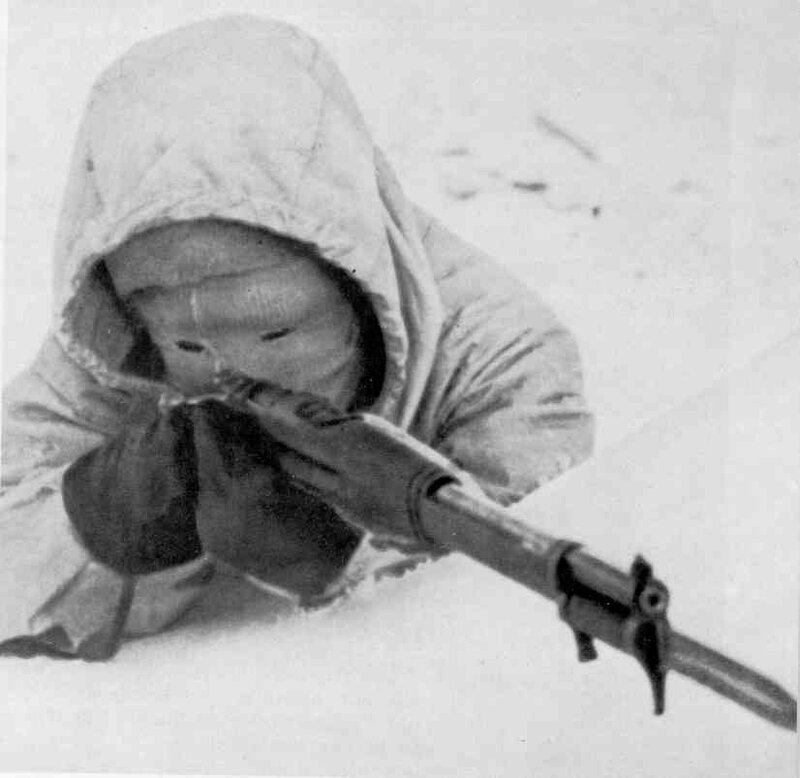 Soldier in snow with rifle